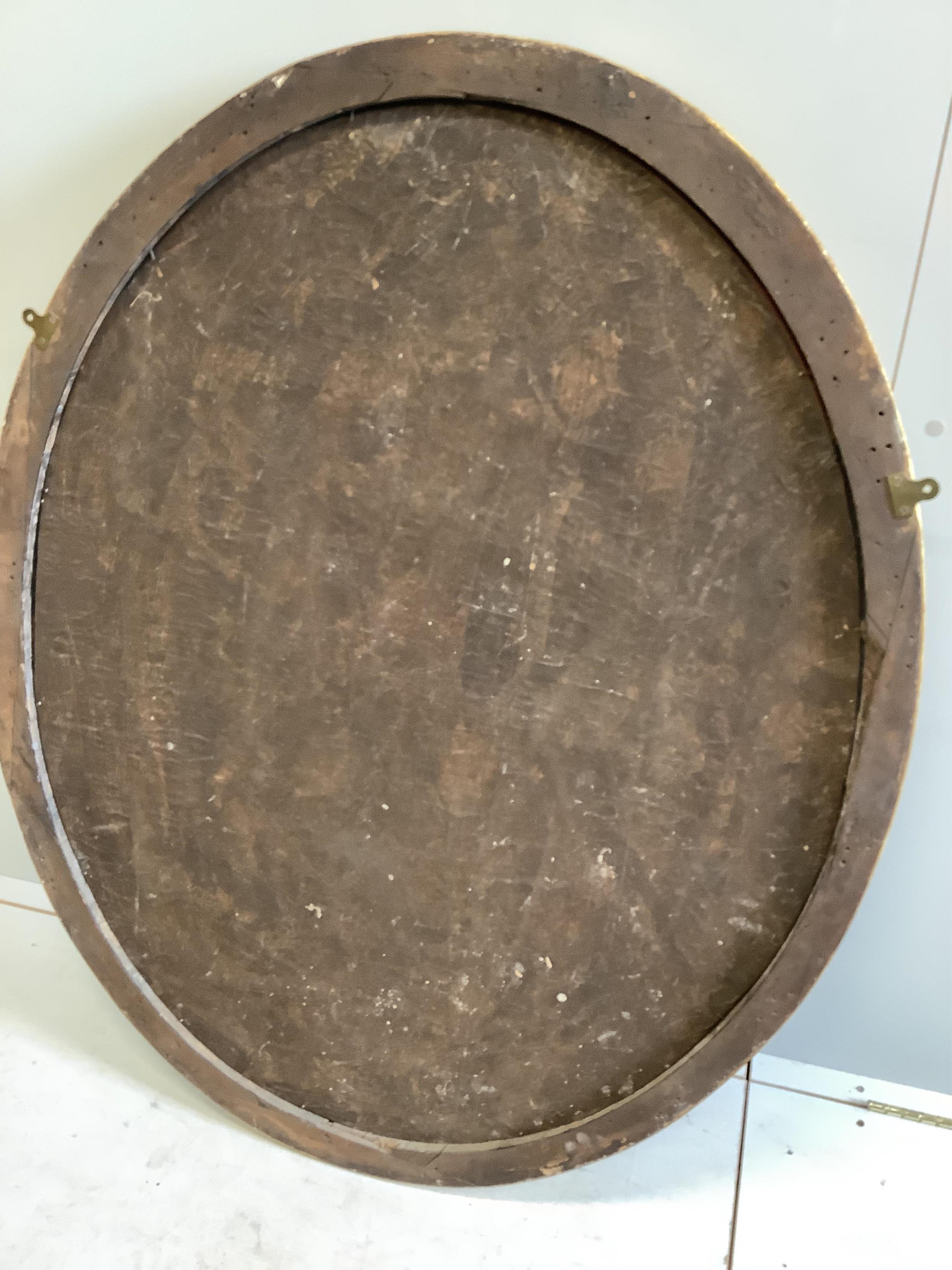A George III style oval giltwood marginal plate wall mirror, width 98cm, height 125cm. Condition - fair